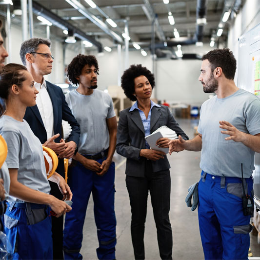 Warehouse workers planning a meeting