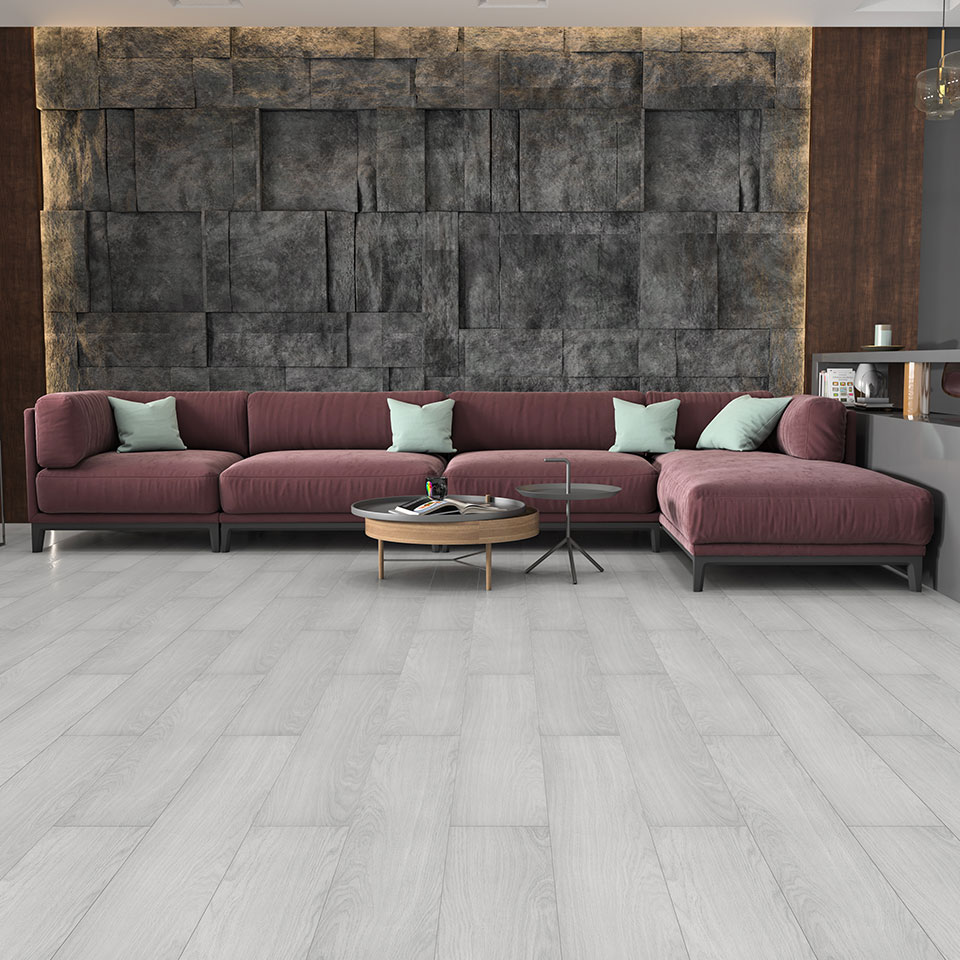Burgandy sofa on light grey laminate flooring