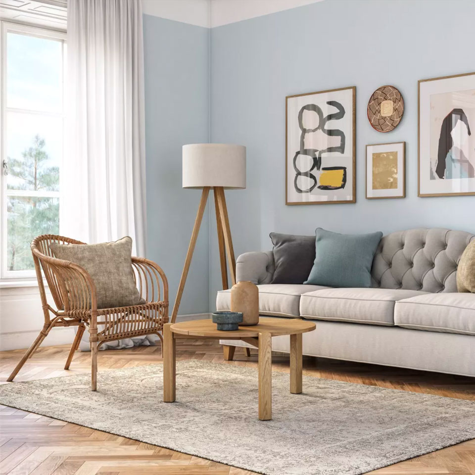 Rug in a cosy area with a wooden table and armchair on it