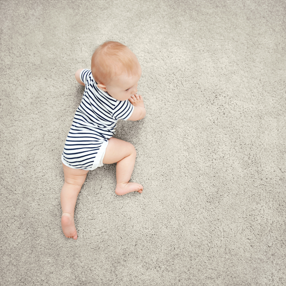 Love saxony carpet in colour Sesame with a baby crawling on it