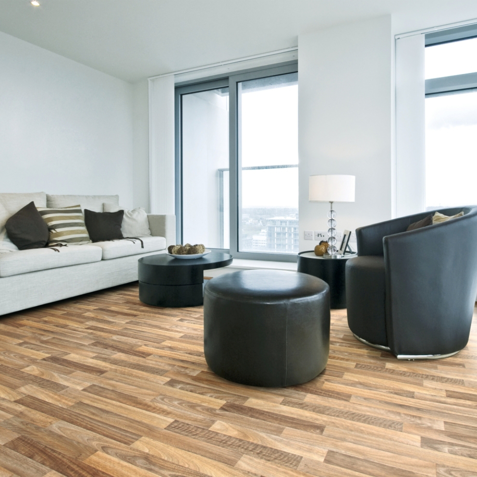 Wood effect vinyl in modern living room with black armchair and sofa